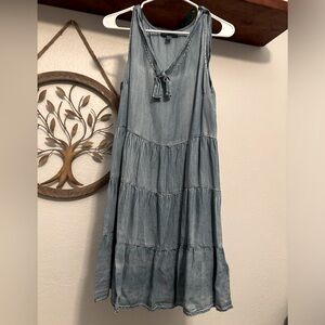 Small light denim colored sleeveless dress.